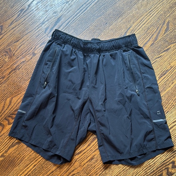 E.   Tommy John black elastic waist vented technical fabric shorts. Medium. - Picture 1 of 4